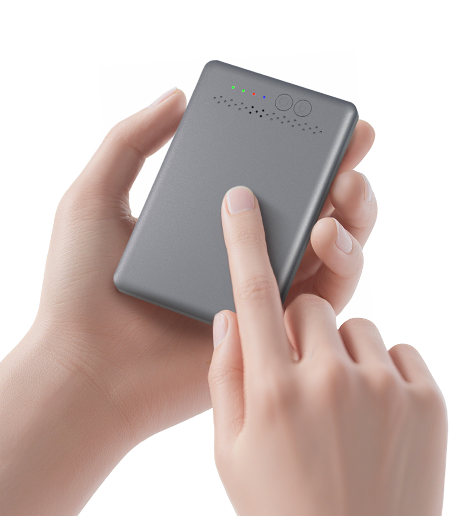 A person holds a voice recorder and touches its surface, with an indicator light visible on the top.