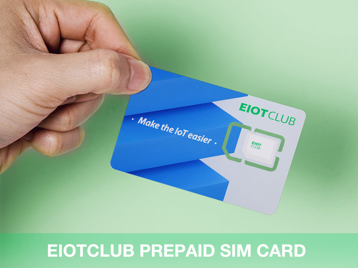 A hand holding the blue and white EIOTCLUB prepaid SIM card against a green background.