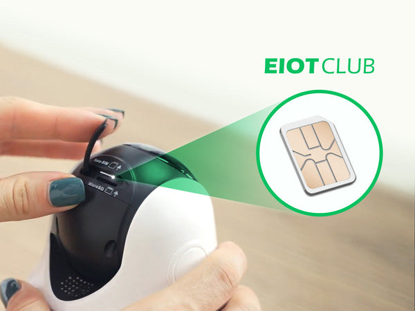 A close-up showing an EIOTCLUB SIM card being inserted into a security camera to enable cellular connectivity.