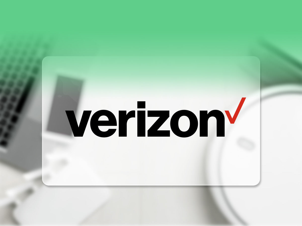 The Verizon logo over a blurred image of a tech workspace.