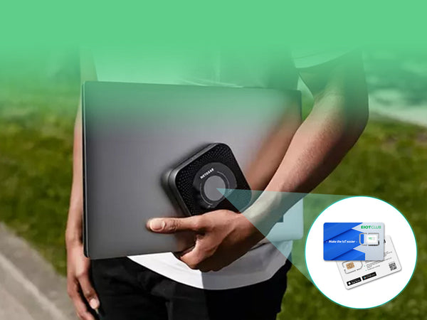A person carrying a laptop and a portable Wi-Fi hotspot, with an EIOTCLUB SIM card featured.