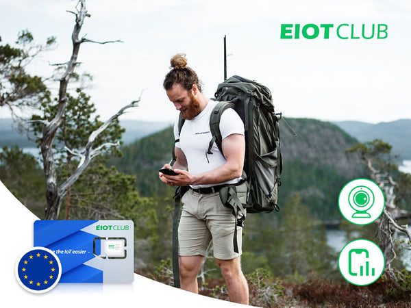 A man hiking in the wilderness while using his smartphone, with an EIOTCLUB European SIM card featured.