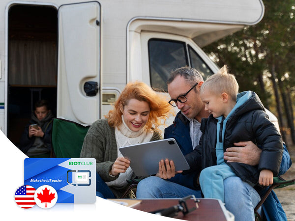 A family enjoys using a tablet outside their camper van, with a Dot Club travel SIM card for the USA and Canada featured.