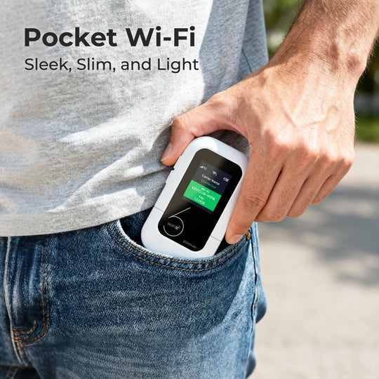 A hand placing a compact white pocket Wi-Fi device into the front pocket of jeans.